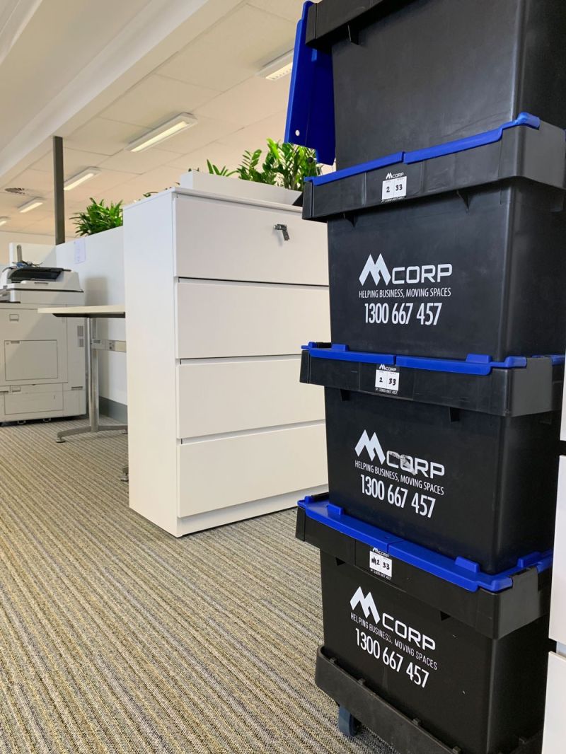 Mcorp crates next to filing cabinet