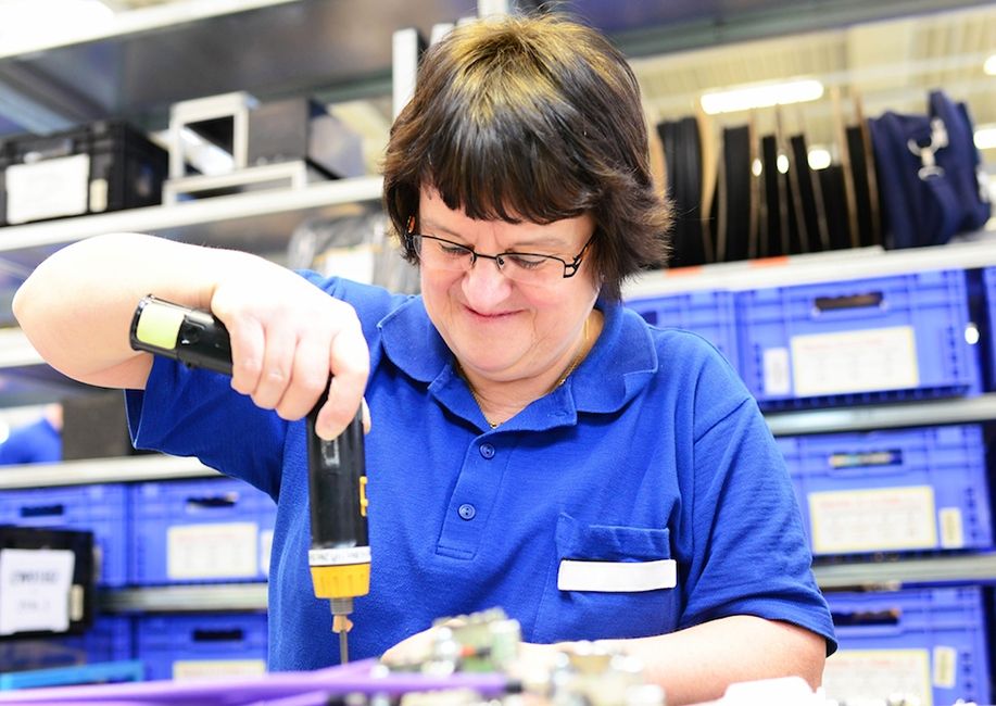 Woman assembling electrical parts copy 86de59466cef5898fefadb121a2c1f06